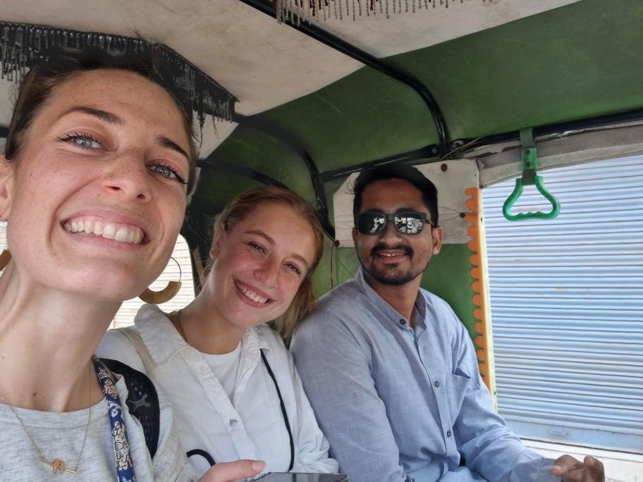 female toursit enjoying the tuk tuk ride with private tour guide in india