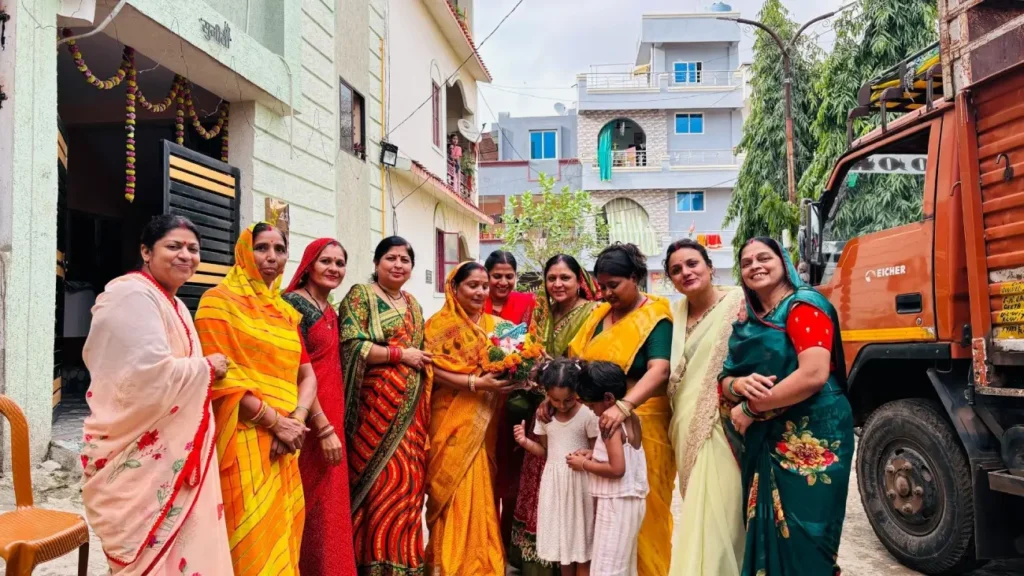 Cultures of India: Exploring the Soul of a Timeless Civilization 3 Women dressed in colorful traditional sarees gather in a residential neighborhood during an Indian cultural celebration, showcasing community bonding, festive traditions, and vibrant ethnic attire.